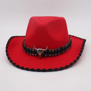 Detail of red fedora hat with silver bull head charm and ethnic pattern ribbon