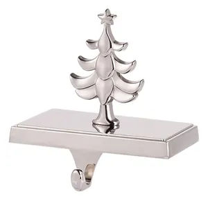 Detailed view of silver Christmas tree stocking holder hook for mantel decoration
