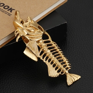 Vintage gold fishbone pendant necklace on a long chain for fashionable sweater jewelry