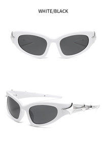 Detail of white cat eye sunglasses featuring silver metallic spikes and black lenses