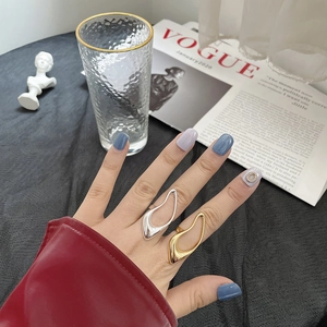 Irregular hollow s925 silver and gold rings shown on fingers for a trendy hip-hop style