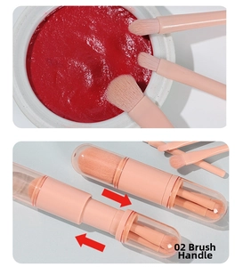 Detail of pink telescopic makeup brush set showing the soft bristles and portable handle