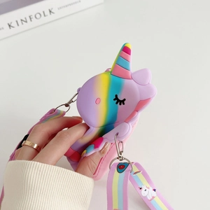 Detail of purple silicone unicorn crossbody bag featuring adjustable rainbow pattern strap