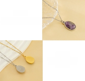 Detail view of water drop natural stone pendant with stainless steel O-chain and textures