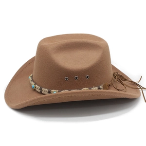 Detail of brown western cowboy hat featuring turquoise beads and leather tassels