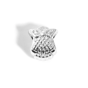Macro detail of silver owl charm bead with intricate feather textures for DIY jewelry