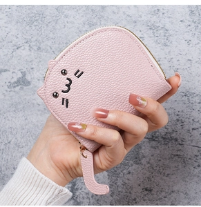 Close-up of pink cat-shaped coin purse featuring litchi texture leather and golden zipper