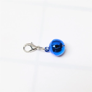 Close-up of a glossy blue metal bell with a silver lobster clasp for pet collars
