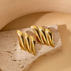 Golden wave textured earrings in irregular geometric design on minimalist stone