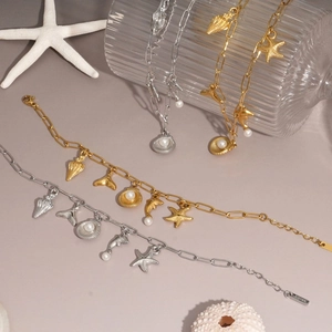 Marine stainless steel bracelets with seashell and starfish charms in gold and silver