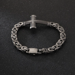 Men's titanium steel Byzantine chain bracelet with a textured cross on black background