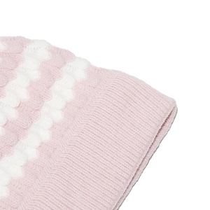 Detail of pink and white striped knit beanie showing soft wool texture and ribbed edge