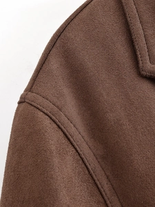 Detailed macro view of dark brown faux suede coat collar with premium double stitching