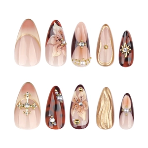 3D floral press-on nails with tortoiseshell texture and golden almond shape design