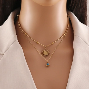 Double-layer gold stainless steel necklace with sun charm and blue evil eye pendant