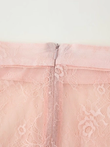 Detail shot of pink lace texture with high-quality invisible zipper on the skirt