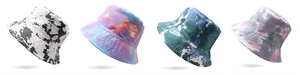 Multiple tie-dye bucket hats in various color patterns with dense stitching detail
