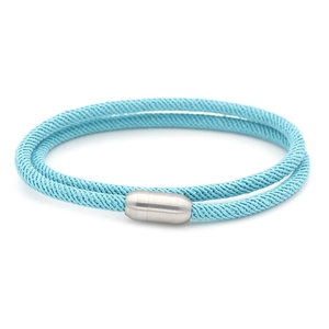 Close-up of light blue braided rope texture and silver magnetic metal clasp detail