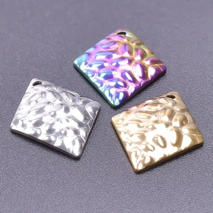 Detail of square hammered texture pendants in gold, silver and rainbow plated steel