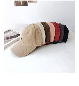Detail view of cotton canvas baseball caps in various colors with embroidered number 7