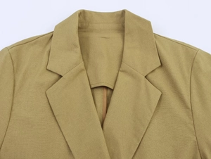 Detail of notch lapel and shoulder on tan linen blend double-breasted blazer for women
