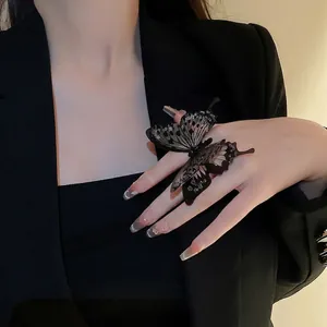 Dramatic oversized black acrylic butterfly open ring with sparkling rhinestone accents
