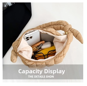 Top view of beige quilted puff bag showing large capacity for phone and accessories