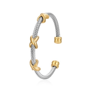 Detail of twisted cable bangle with silver wire texture and gold X-shaped accents
