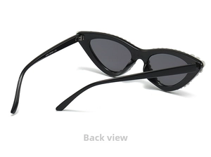 Detailed back view of cat-eye sunglasses featuring white pearl inlay and black frame