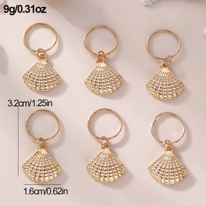 Detail view of six golden shell charms with dimensions 3.2cm for DIY hair accessories