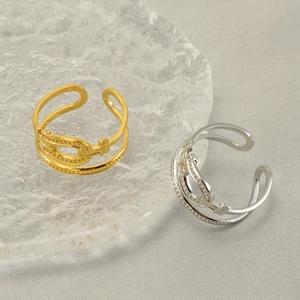 Adjustable horseshoe buckle rings in gold and silver finish with minimalist design
