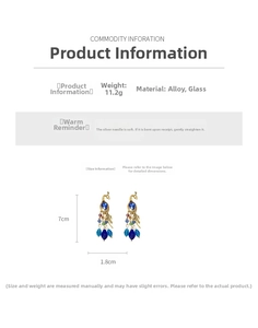 Detailed size and weight specs for vintage gold peacock earrings with colorful glass