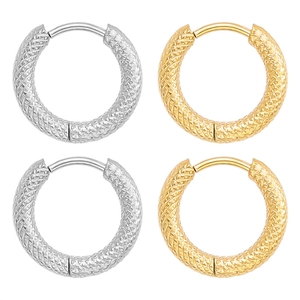 Detail of 18K gold and silver hoop earrings with diamond knurled texture and hinge