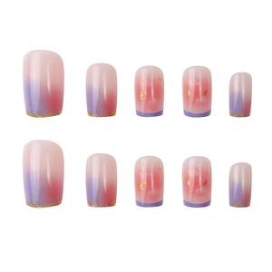 Reusable press-on nails with red gradient, white cloud patterns, and gold foil accents