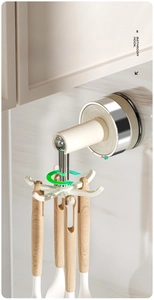 Detailed view of a 360-degree rotating six-prong kitchen hook rack installed under a cabinet