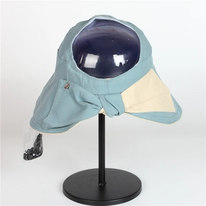 Detail of blue sun hat showing side color contrast, metal ornament and windproof cord