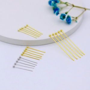 Detailed display of 14k gold-filled and silver ball pins for DIY jewelry making