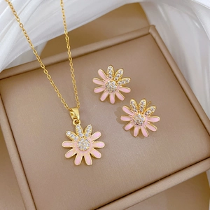 Luxury daisy jewelry set with pink enamel necklace and stud earrings in gold finish