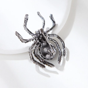Detailed back view of the vintage spider brooch showing the secure safety pin fastening