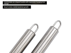 Detail of stainless steel lemon zester handle with ergonomic round grip and hanging hook