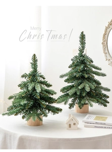 Mini Nordic Christmas tree set with natural wooden base on table for holiday decoration