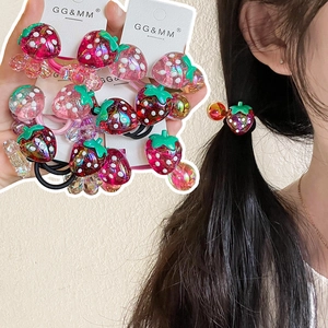 Detail of strawberry elastic hair ties and model showing various colors on hair