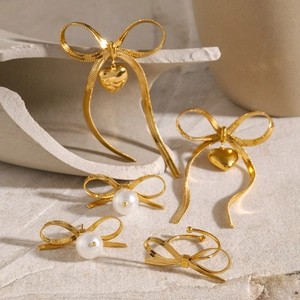18K gold-plated stainless steel jewelry set with bow tie and heart-shaped pendants