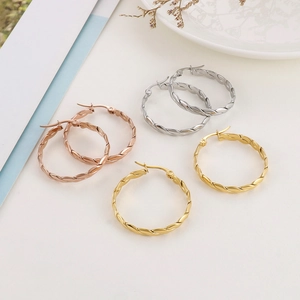 Chic twisted metal hoop earrings in gold silver and rose gold finishes for women