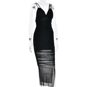 Detail of black mesh patchwork on backless evening dress with ruching and sheer hemline