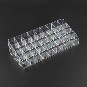 Detailed 45-degree view of a clear acrylic multi-slot lipstick and cosmetic storage box