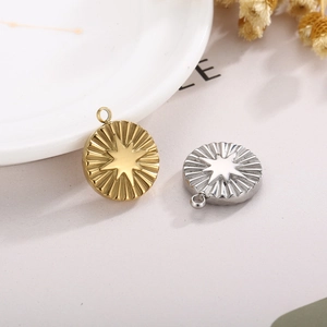 Gold and silver stainless steel round starburst pendants with geometric pleated texture