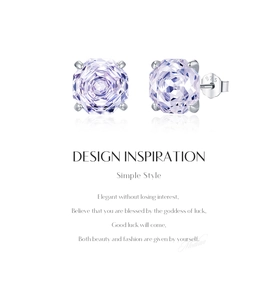 Macro shot of 925 silver stud earrings featuring purple octagonal-cut crystal stones