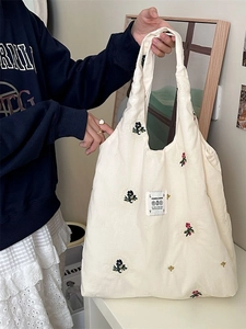 Cream canvas tote bag with colorful floral embroidery and large capacity for women
