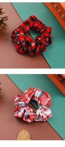Detail of red plaid and tricolor checkered scrunchies on a festive holiday background